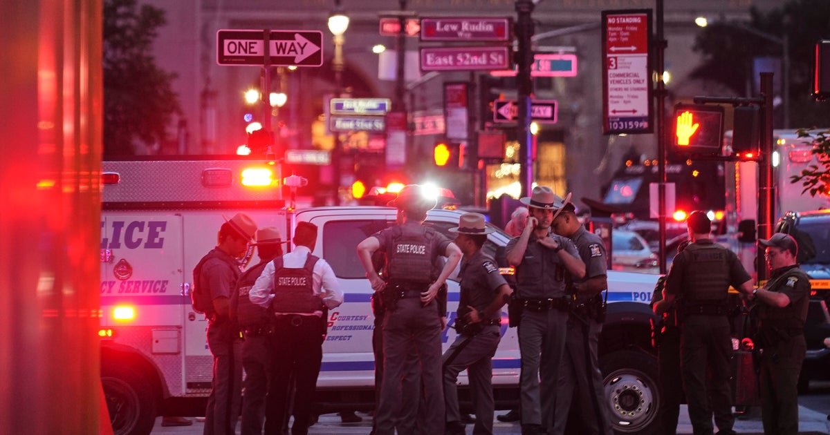 Chaotic scene in Midtown Manhattan as Shots Ring Out in Office Tower, killing 4 including police officer